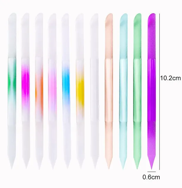 Fanned crystal-glass nail sticks resting in a glass dish