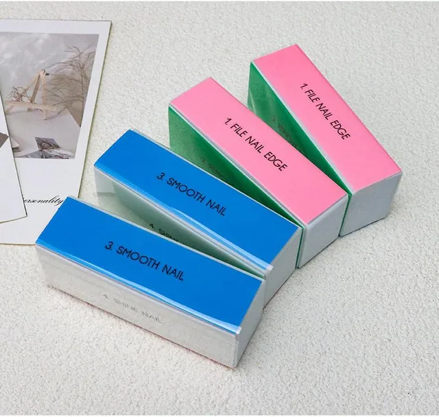 Sponge polishing blocks arranged on a desk beside a magazine and a card