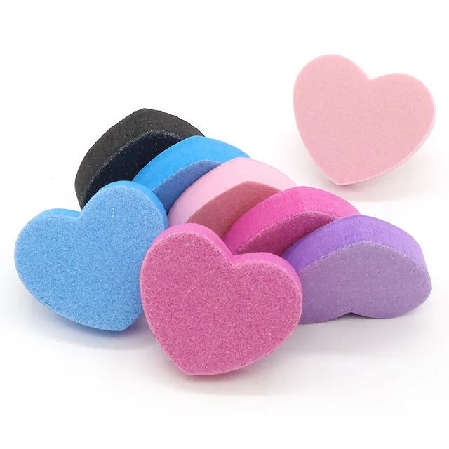 Heart-shaped blocks in black, blue, pink and purple fanned out on a white background