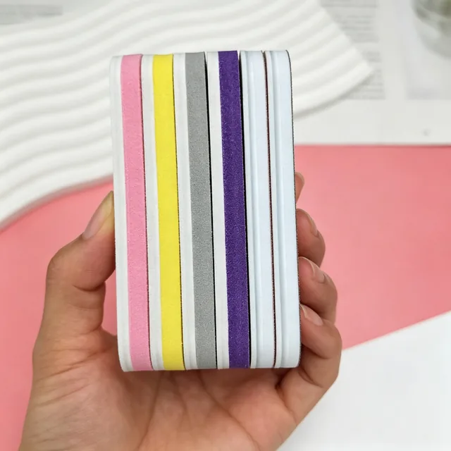 Stack of mini straight nail files held edge-on showing the coloured sponge layers