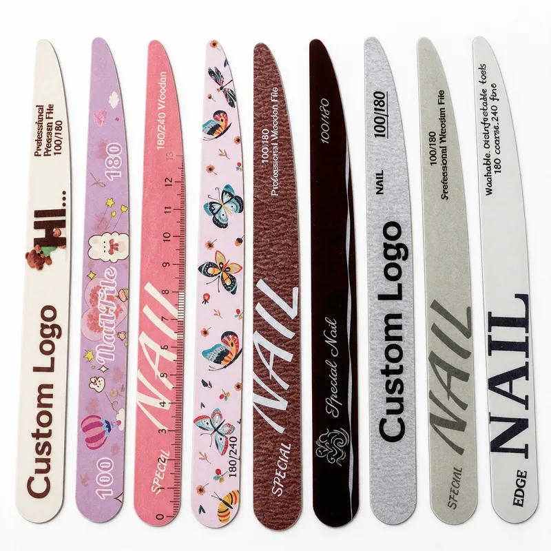 Nine ultra-thin printed wooden nail files in assorted designs lined up on a white background